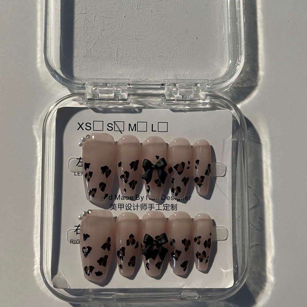 Nude Press-On Nails with Black Bow and Heart Design